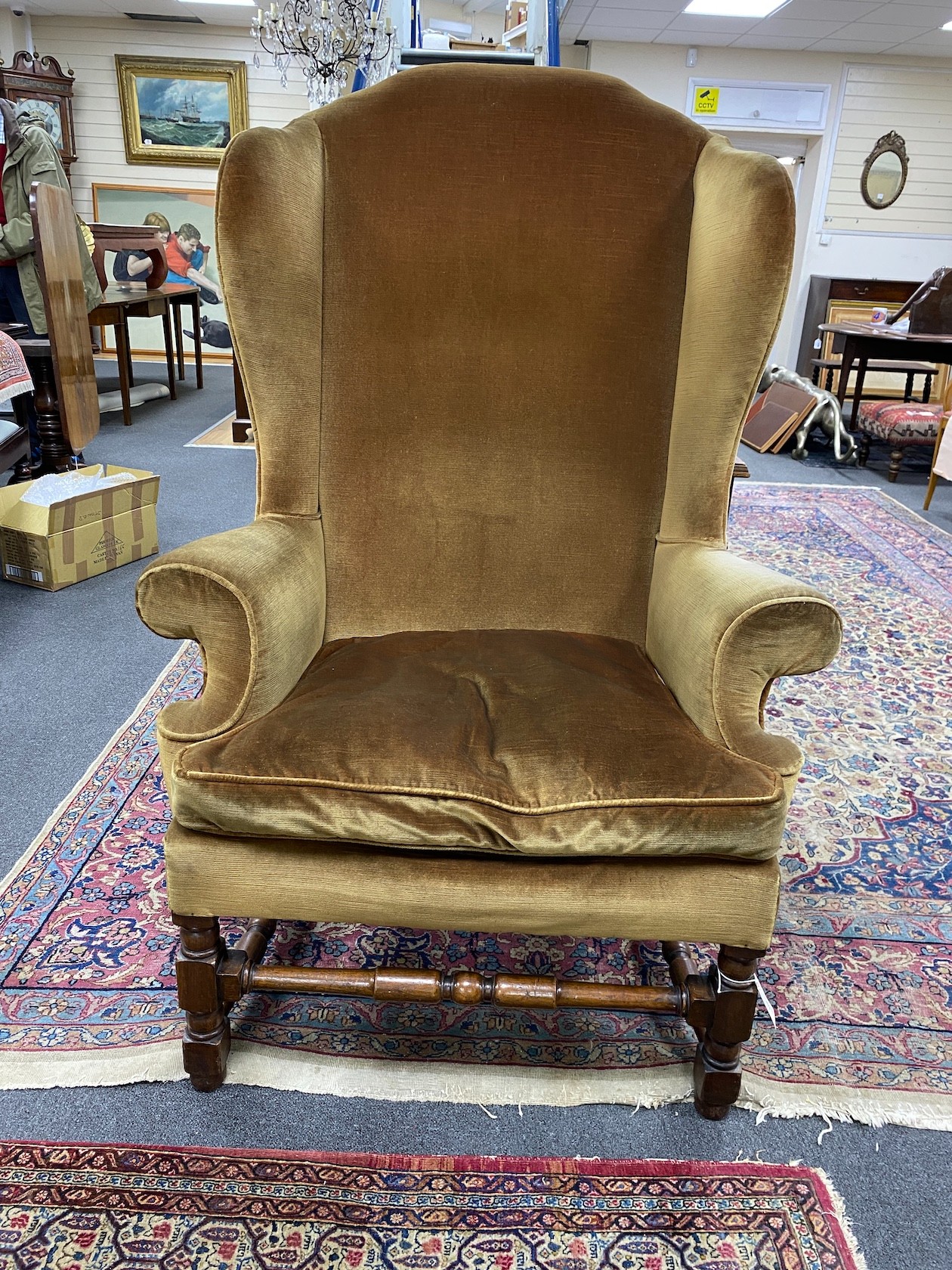 A French Louis XIV walnut wingback armchair